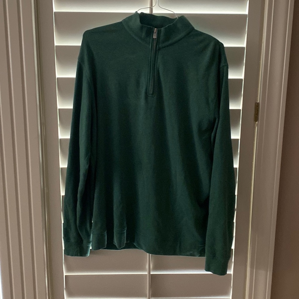 Peter Millar quarter-zip in balsam green.